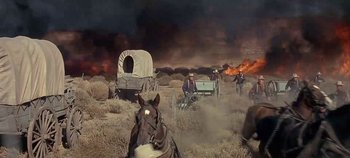 Movie still from “Cheyenne Autumn” (1964), directed by John Ford – A group of men riding horses in a field; Wide shot, High angle