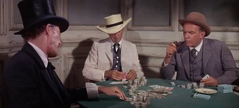 Movie still from “Cheyenne Autumn” (1964), directed by John Ford – A group of men sitting at a table playing cards; Medium shot, Over the shoulder angle