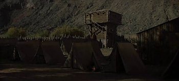 Movie still from “Cheyenne Autumn” (1964), directed by John Ford – An image of an outdoor scene with tents and a tower; Extreme Wide shot, Low angle