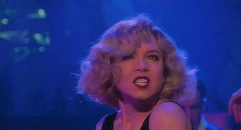 Movie still from “Chicago” (2002), directed by Rob Marshall – A woman with blonde hair and a black top; Close Up shot, Low angle