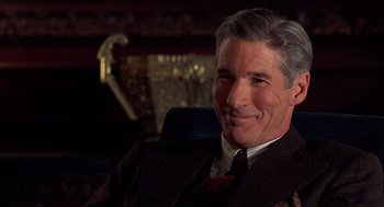 Movie still from “Chicago” (2002), directed by Rob Marshall – A person wearing a suit and tie; Close Up shot, Over the shoulder angle