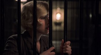 Movie still from “Chicago” (2002), directed by Rob Marshall – A woman looking through the bars of a jail cell; Close Up shot, High angle