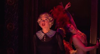 Movie still from “Chicago” (2002), directed by Rob Marshall – A woman in a black dress and a woman in a red dress; Medium shot, Over the shoulder angle