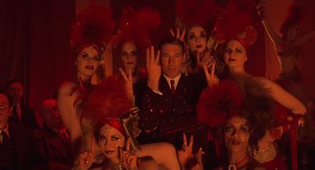 Movie still from “Chicago” (2002), directed by Rob Marshall – A group of people dressed up in costumes and posing for a picture; Close Up shot, High angle