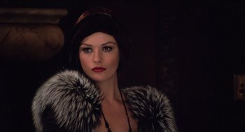 Movie still from “Chicago” (2002), directed by Rob Marshall – A woman wearing a fur coat and a hat; Close Up shot, Over the shoulder angle