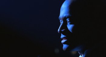 Movie still from “Chicago” (2002), directed by Rob Marshall – A person's face in the dark; Close Up shot, Low angle