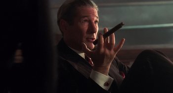 Movie still from “Chicago” (2002), directed by Rob Marshall – A person holding a cigar; Close Up shot, Low angle