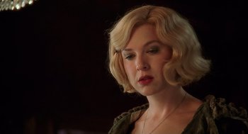 Movie still from “Chicago” (2002), directed by Rob Marshall – A woman with blonde curly hair wearing a green shirt; Close Up shot, Over the shoulder angle