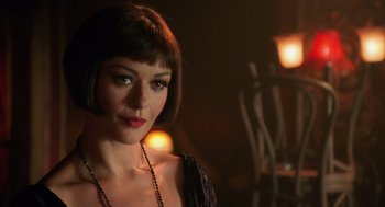 Movie still from “Chicago” (2002), directed by Rob Marshall – A beautiful woman with short brown hair wearing a necklace; Close Up shot, Over the shoulder angle