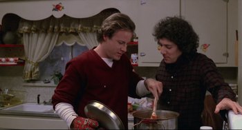 Movie still from “Chilly Scenes of Winter” (1979), directed by Joan Micklin Silver – Two people in a kitchen preparing a meal together; Medium shot, Low angle