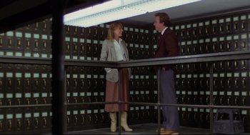 Movie still from “Chilly Scenes of Winter” (1979), directed by Joan Micklin Silver – A man and a woman standing next to each other; Wide shot, Low angle