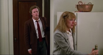 Movie still from “Chilly Scenes of Winter” (1979), directed by Joan Micklin Silver – A man and a woman standing next to each other in a room; Medium shot, Low angle