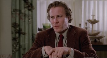 Movie still from “Chilly Scenes of Winter” (1979), directed by Joan Micklin Silver – A person wearing a suit and tie; Close Up shot, Low angle