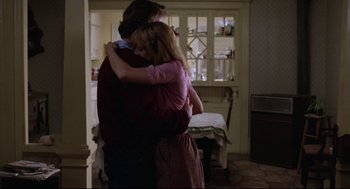 Movie still from “Chilly Scenes of Winter” (1979), directed by Joan Micklin Silver – A man and a woman hugging in a room; Medium shot, Over the shoulder angle
