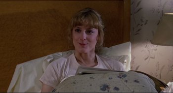 Movie still from “Chilly Scenes of Winter” (1979), directed by Joan Micklin Silver – A woman laying in a bed looking at the camera; Close Up shot, High angle