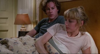 Movie still from “Chilly Scenes of Winter” (1979), directed by Joan Micklin Silver – A man and a woman sitting on a bed; Medium shot, Over the shoulder angle