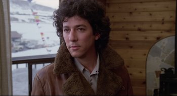 Movie still from “Chilly Scenes of Winter” (1979), directed by Joan Micklin Silver – A man in a brown leather jacket with a curly hair style; Close Up shot, Low angle