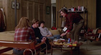 Movie still from “Chilly Scenes of Winter” (1979), directed by Joan Micklin Silver – A group of people sitting in a living room; Wide shot, High angle