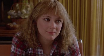 Movie still from “Chilly Scenes of Winter” (1979), directed by Joan Micklin Silver – A person wearing a plaid shirt; Close Up shot, Over the shoulder angle