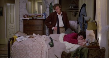 Movie still from “Chilly Scenes of Winter” (1979), directed by Joan Micklin Silver – A man and a woman are sitting on a bed; Medium shot, High angle