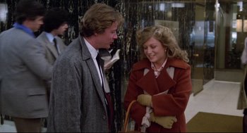 A man and a woman standing next to each other