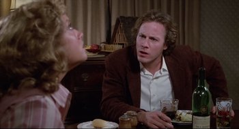 Movie still from “Chilly Scenes of Winter” (1979), directed by Joan Micklin Silver – A man and a woman sitting at a dinner table; Close Up shot, Over the shoulder angle
