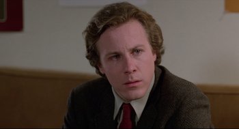 Movie still from “Chilly Scenes of Winter” (1979), directed by Joan Micklin Silver – A person wearing a suit and tie; Close Up shot, Low angle