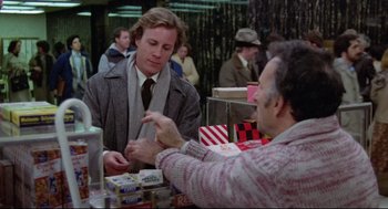 Two men are talking to each other at a table