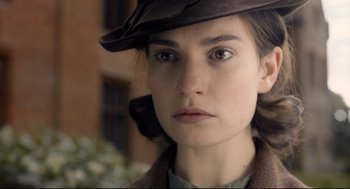 Movie still from “Darkest Hour” (2017), directed by Joe Wright – A person wearing a hat; Close Up shot, Over the shoulder angle