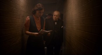 Movie still from “Darkest Hour” (2017), directed by Joe Wright – Medium shot, Over the shoulder angle