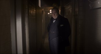 Movie still from “Darkest Hour” (2017), directed by Joe Wright – Medium shot, Low angle