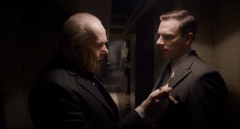 Movie still from “Darkest Hour” (2017), directed by Joe Wright – Medium shot, Over the shoulder angle