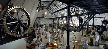 Movie still from “Chitty Chitty Bang Bang” (1968), directed by Ken Hughes – A group of men in white shirts and white ties; Extreme Wide shot, High angle