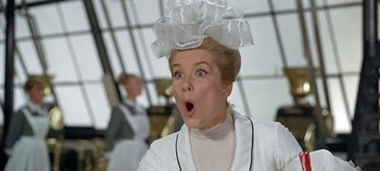 Movie still from “Chitty Chitty Bang Bang” (1968), directed by Ken Hughes – A woman with a surprised look on her face; Close Up shot, Low angle