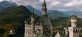 Movie still from “Chitty Chitty Bang Bang” (1968), directed by Ken Hughes – A castle like building in the middle of a valley; Extreme Wide shot, Low angle