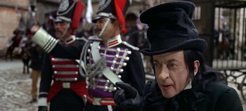 Movie still from “Chitty Chitty Bang Bang” (1968), directed by Ken Hughes – A group of men in costumes standing next to each other; Close Up shot, Over the shoulder angle