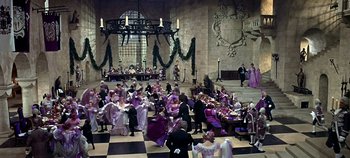 Movie still from “Chitty Chitty Bang Bang” (1968), directed by Ken Hughes – A group of people dressed in formal attire; Extreme Wide shot, High angle