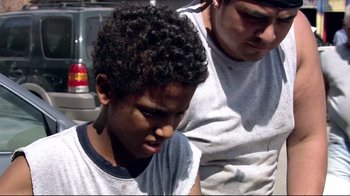 Movie still from “Chop Shop” (2007), directed by Ramin Bahrani – A man and a boy looking at each other; Close Up shot, High angle