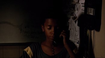 Movie still from “Chop Shop” (2007), directed by Ramin Bahrani – A young boy is talking on the phone; Close Up shot, High angle