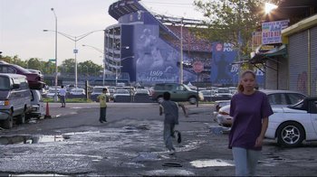 Movie still from “Chop Shop” (2007), directed by Ramin Bahrani – A group of kids playing baseball in a parking lot; Wide shot, Over the shoulder angle