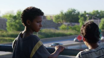 Movie still from “Chop Shop” (2007), directed by Ramin Bahrani – A young boy sitting next to another young boy; Close Up shot, Over the shoulder angle