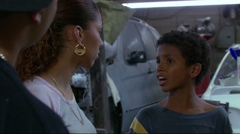 Movie still from “Chop Shop” (2007), directed by Ramin Bahrani – A woman and a young boy talking to each other; Close Up shot, Over the shoulder angle