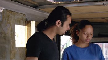 Movie still from “Chop Shop” (2007), directed by Ramin Bahrani – A man and a woman standing next to each other; Close Up shot, Low angle