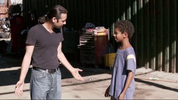Movie still from “Chop Shop” (2007), directed by Ramin Bahrani – A man and a boy are talking outside; Medium shot, Over the shoulder angle