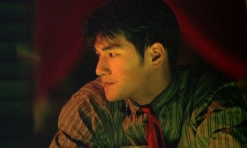 Movie still from “Chungking Express” (1994), directed by Kar-Wai Wong – A young man wearing a red neck tie; Close Up shot, Low angle