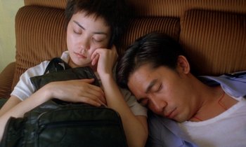 Movie still from “Chungking Express” (1994), directed by Kar-Wai Wong – A man and a woman are sleeping on a couch; Close Up shot, High angle