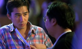 Movie still from “Chungking Express” (1994), directed by Kar-Wai Wong – A man holding a knife in front of another man; Close Up shot, Over the shoulder angle