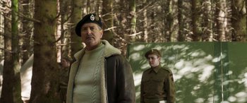 Movie still from “Churchill” (2017), directed by Jonathan Teplitzky – A man in a military uniform standing next to another man in a military uniform; Medium shot, Over the shoulder angle