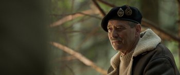Movie still from “Churchill” (2017), directed by Jonathan Teplitzky – An older man wearing a hat and a jacket; Close Up shot, Low angle