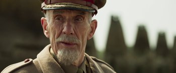 Movie still from “Churchill” (2017), directed by Jonathan Teplitzky – An old man wearing a military uniform and a hat; Close Up shot, Low angle